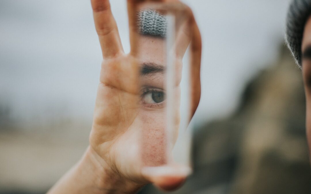 shallow focus of person holding mirror
